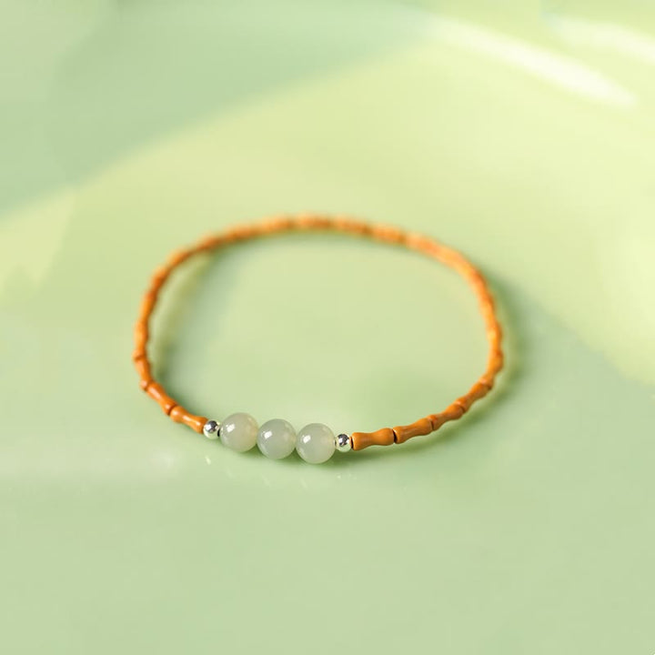 Pulsera de la suerte con cuentas de jade hetiano con patrón de bambú de oliva natural con Buddha Stones
