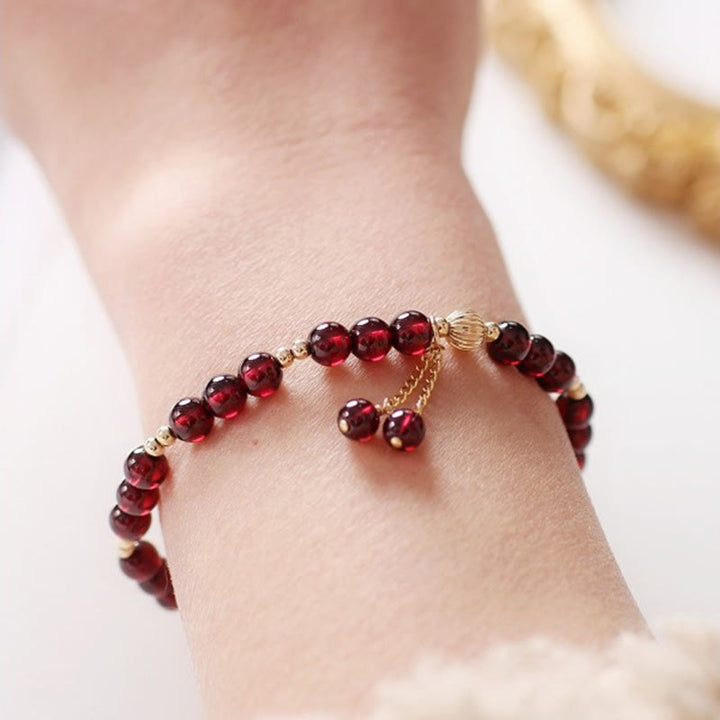 Pulsera Calm de granate natural de oro de 14 quilates con Buddha Stones
