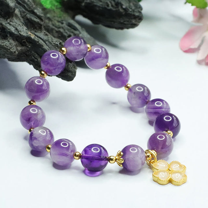 Pulsera con dije de trébol de cuatro hojas y paz interior de cristal de amatista natural con piedras de Buddha Stones