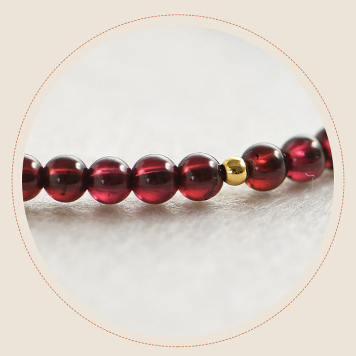 Pulsera de estabilidad con cuentas doradas y granate natural con Buddha Stones
