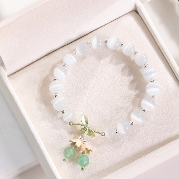 Pulsera con dije de orquídea de la paz, cristal rosa, calcedonia azul, aventurina verde, ojo de gato , Buddha Stones - Ojo de gato y aventurina verde - image 0