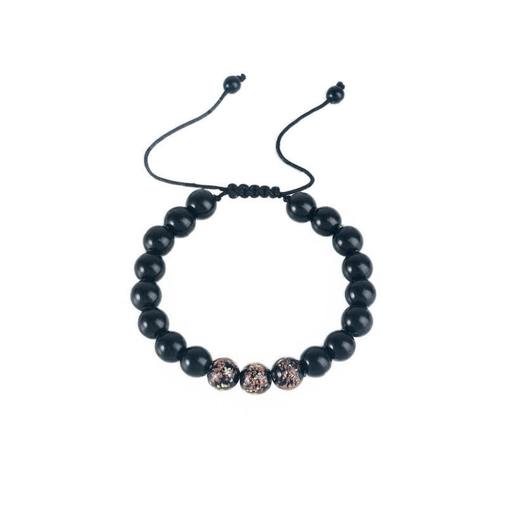 Pulsera de fuerza con piedra luminosa luminosa de obsidiana negra de Buddha Stones