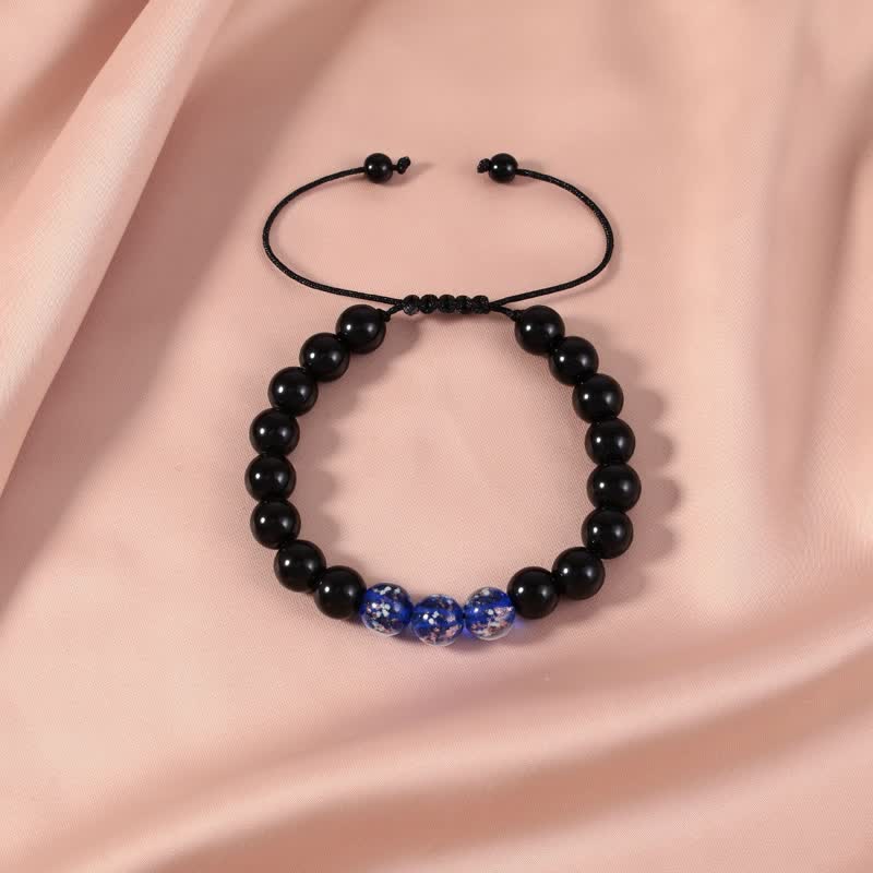 Pulsera de fuerza con piedra luminosa luminosa de obsidiana negra de Buddha Stones