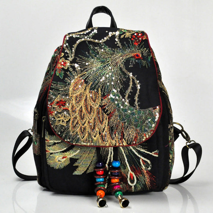 Mochila con borlas de lona con bordado de pavo real
