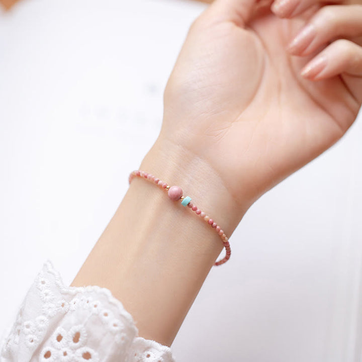 Pulsera de cadena de energía amorosa de rodonita natural chapada en oro de 14 quilates con Buddha Stones