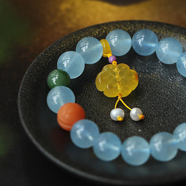 Pulsera de la paz con dije anudado chino, ámbar, aguamarina natural