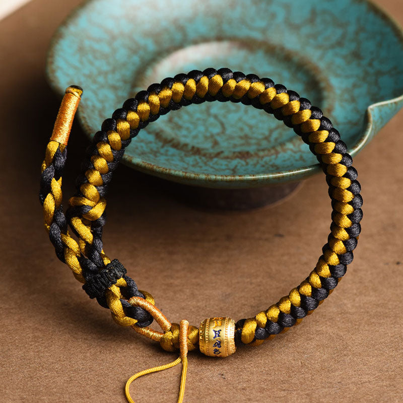 Pulsera de pureza Om Mani Padme Hum de cuerda de dragón de oro negro tibetano hecha a mano con Buddha Stones