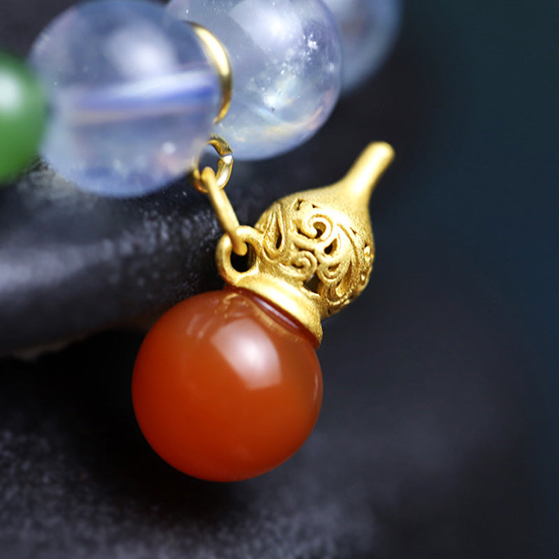 Pulsera con dije de calabaza de la paz con ágata roja y aguamarina