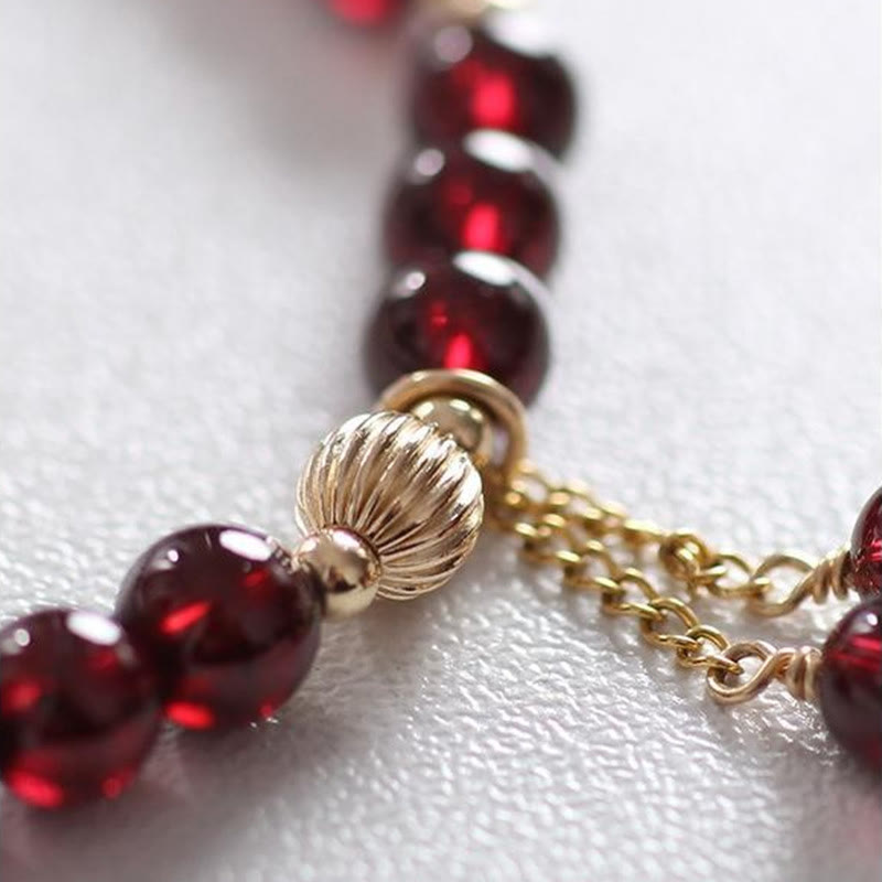 Pulsera Calm de granate natural de oro de 14 quilates con Buddha Stones
