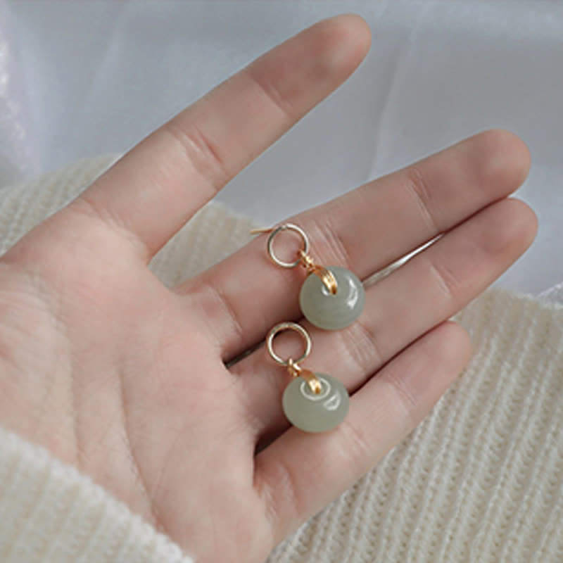 Pendientes colgantes de suerte con hebilla de paz de jade redondo