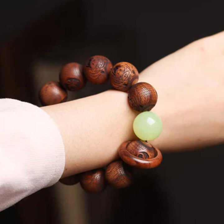 Pulsera de protección de tigre con grabado de palisandro tibetano con Buddha Stones