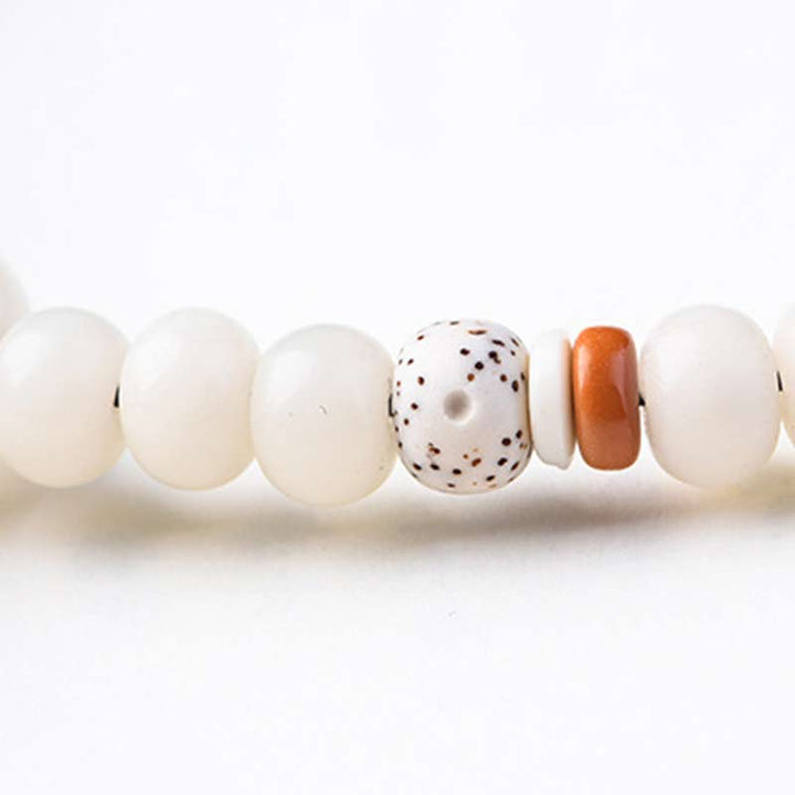 Pulsera de bendición de loto Bodhi de jade blanco tibetano con Buddha Stones