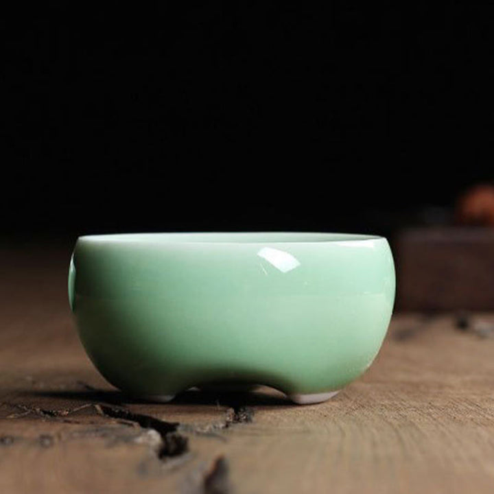 Taza de té de cerámica con forma de pez koi de colores y Buddha Stones