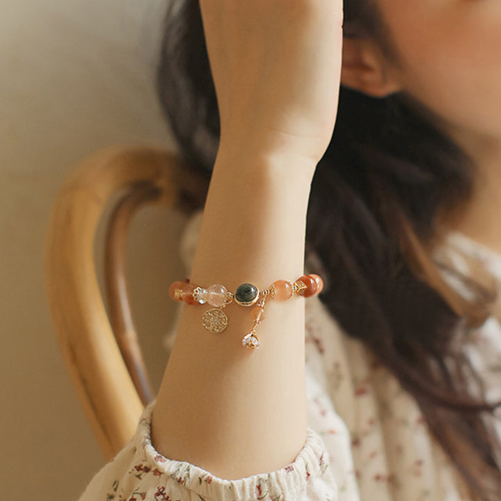 Pulsera de riqueza de flores de estrella de ocho puntas de cuarzo rutilado multicolor natural con Buddha Stones