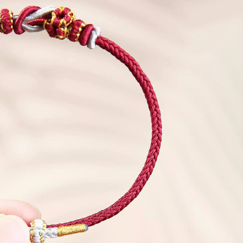 Pulsera de protección de la suerte con nudo de paz de ocho hilos con nudo de flor de melocotón hecho a mano con Buddha Stones