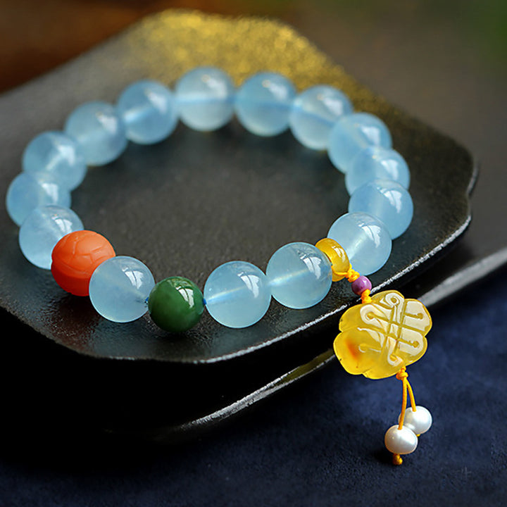Pulsera de la paz con dije anudado chino, ámbar, aguamarina natural