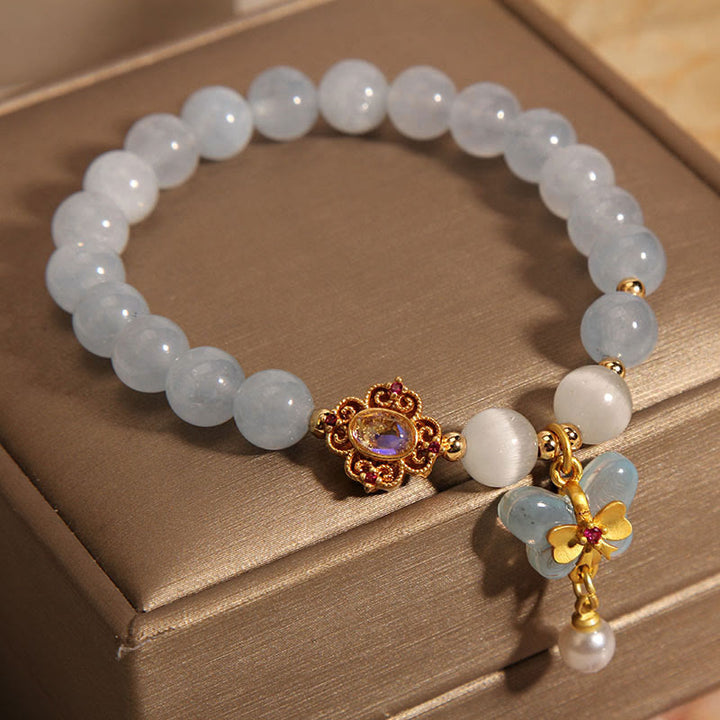 Pulsera con dije de perlas y mariposas curativas con ojo de gato, aguamarina y Buddha Stones