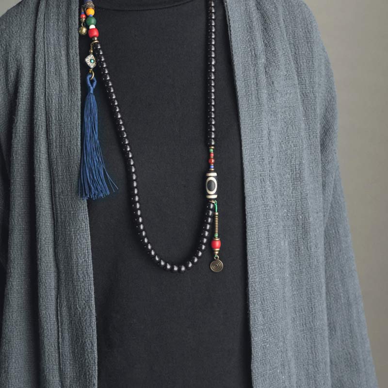 Buddha Stones 108 cuentas Mala madera de ébano cuentas Dzi cobre equilibrio borla pulsera