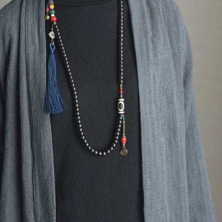 Buddha Stones 108 cuentas Mala madera de ébano cuentas Dzi cobre equilibrio borla pulsera