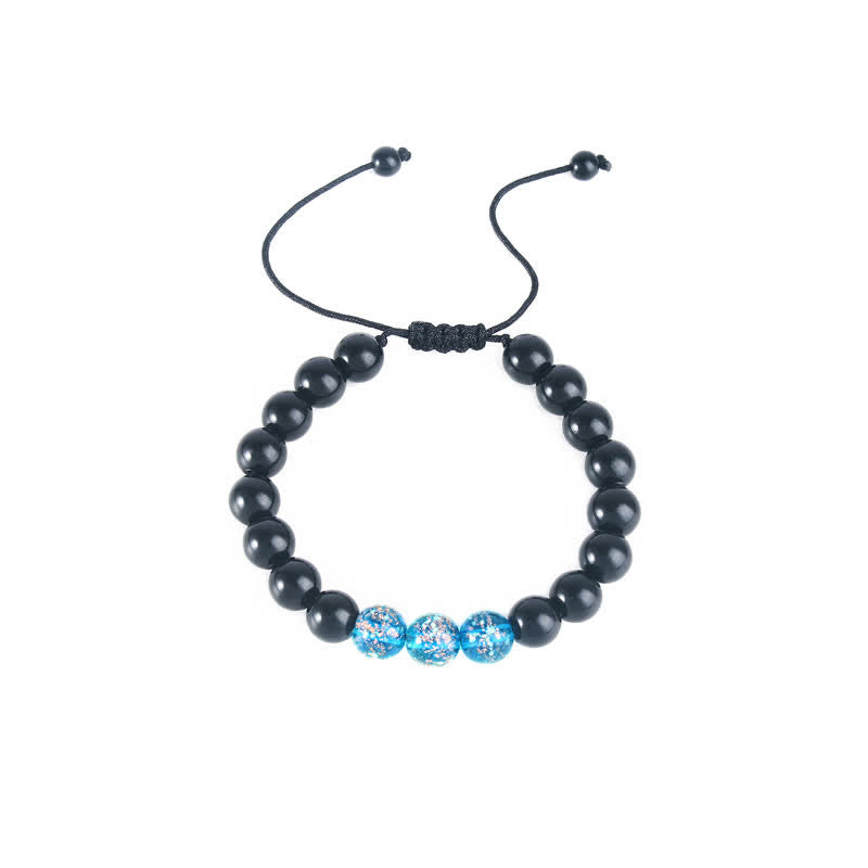 Pulsera de fuerza con piedra luminosa luminosa de obsidiana negra de Buddha Stones