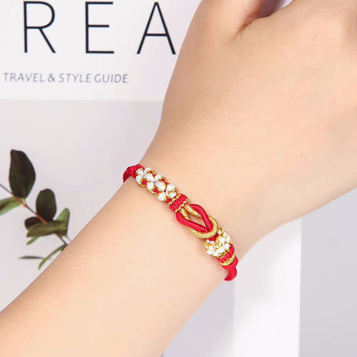 Pulsera de protección de la suerte con nudo de paz de ocho hilos con nudo de flor de melocotón hecho a mano con Buddha Stones