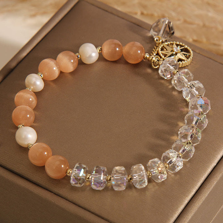 Pulsera de soporte con estrella de cristal blanco y ojo de gato naranja de Buddha Stones