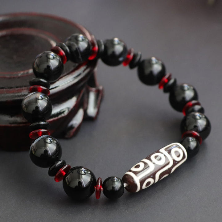 Pulsera de protección de la riqueza con cuentas Dzi de nueve ojos de ónix negro y Buddha Stones