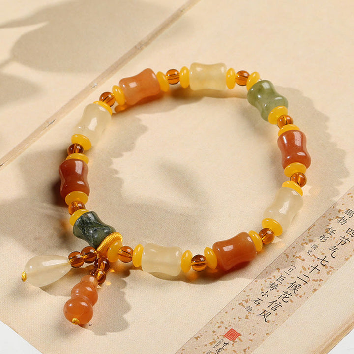 Pulsera con dijes de riqueza de calabaza de jade de seda dorada natural