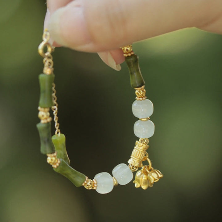 Pulsera de riqueza con Buddha Stones, bambú verde, jade, lirio de los valles