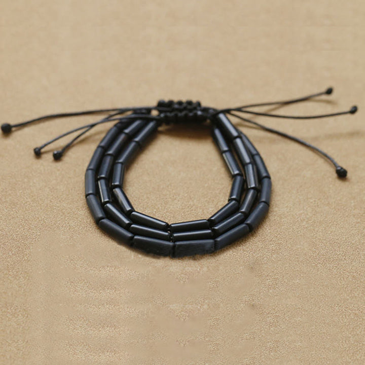 Pulsera de protección de soporte de cuentas de ónix negro con Buddha Stones