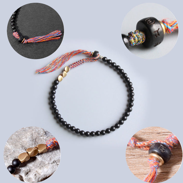 Pulsera con borlas de ónix negro tibetano hecha a mano con Buddha Stones