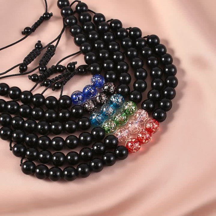 Pulsera de fuerza con piedra luminosa luminosa de obsidiana negra de Buddha Stones