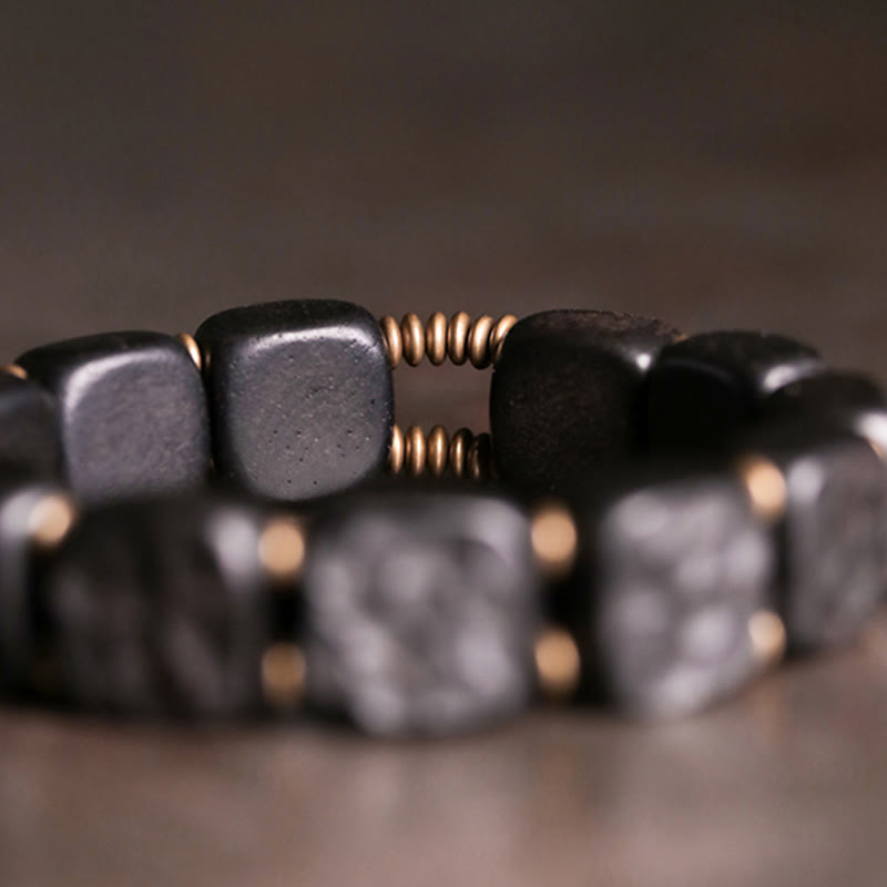 Pulsera de equilibrio de paz de cobre estilo textura de madera de ébano retro con Buddha Stones
