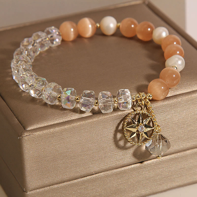 Pulsera de soporte con estrella de cristal blanco y ojo de gato naranja de Buddha Stones