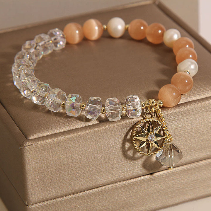 Pulsera de soporte con estrella de cristal blanco y ojo de gato naranja de Buddha Stones