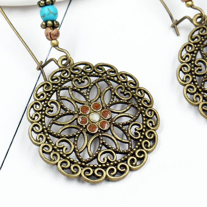 Pendientes colgantes redondos de la suerte con diseño de flores