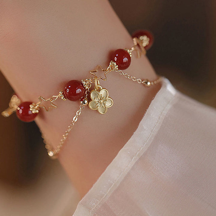 Pulsera tranquila con dije de flor de estrella de ágata roja chapada en oro de 14 Buddha Stones