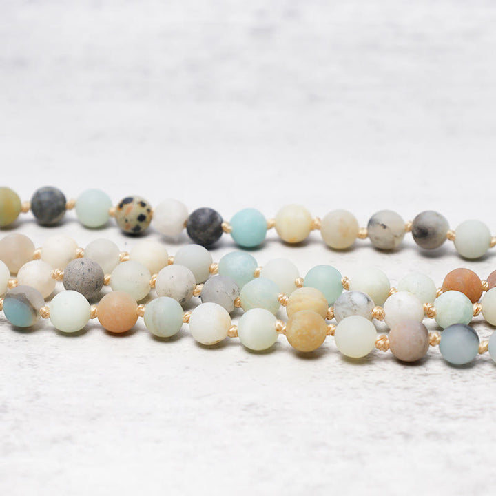 Pulsera Mala con borlas y cuentas de amazonita con 108 Buddha Stones