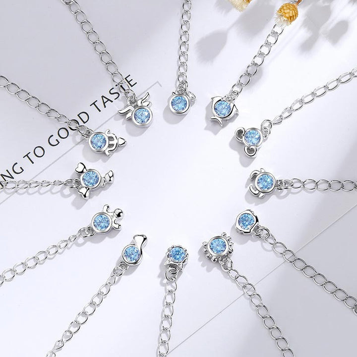 Pulsera con dijes de las 12 constelaciones del zodíaco de cobre bañado en plata 925 con Buddha Stones