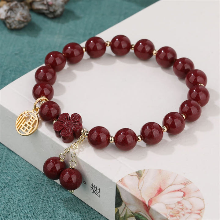 Pulsera de bendición de flor de cerezo con personaje de cinabrio Fu de Buddha Stones