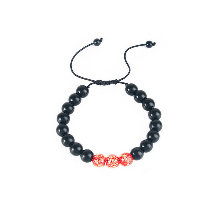 Pulsera de fuerza con piedra luminosa luminosa de obsidiana negra de Buddha Stones