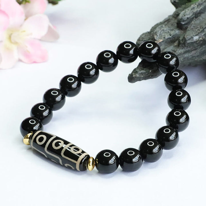 Pulsera de poder de ónix negro con cuentas Dzi tibetanas de nueve ojos de Buddha Stones