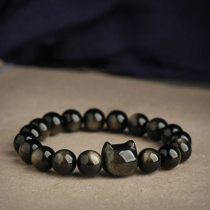 Buddha Stones Obsidiana con brillo dorado Obsidiana con brillo plateado Pata encantadora Pulsera de protección del gato de la suerte - image 1