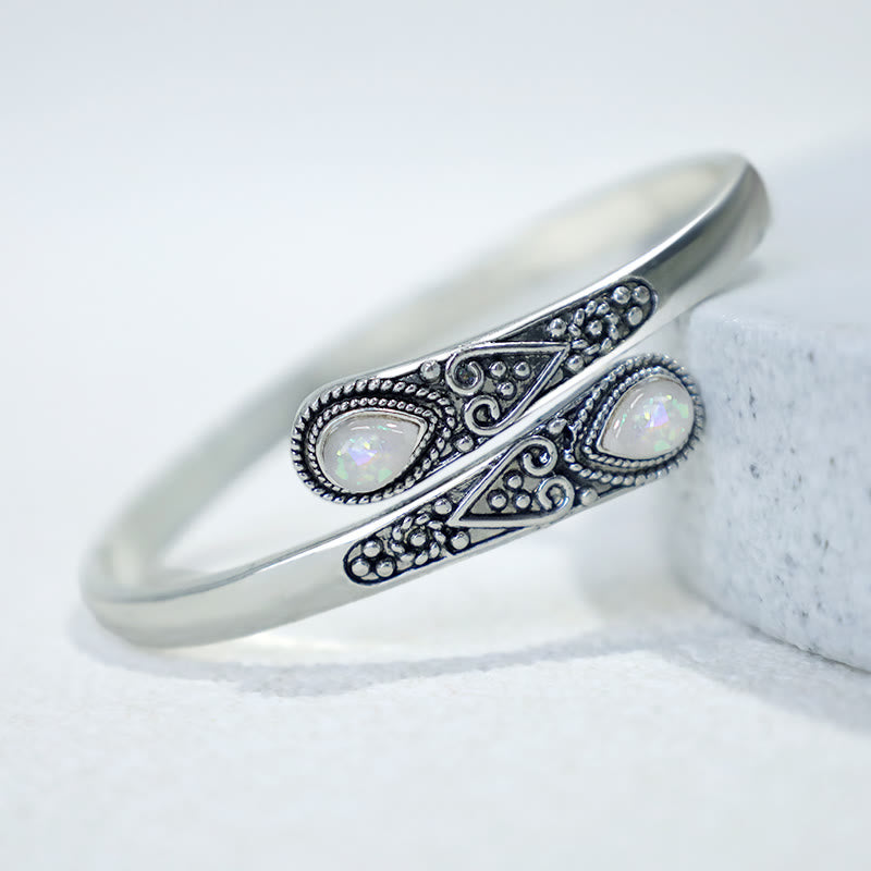 Brazalete de pulsera curativo con patrón de gota de agua de circonita con Buddha Stones