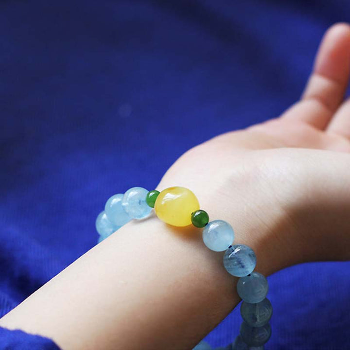 Pulsera curativa de serenidad con cuentas de ámbar y aguamarina natural