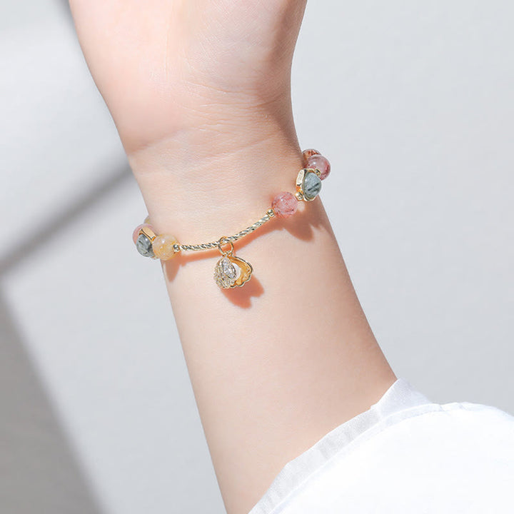 Pulsera de cuentas de protección de concha de cuarzo rutilado de colores naturales con Buddha Stones