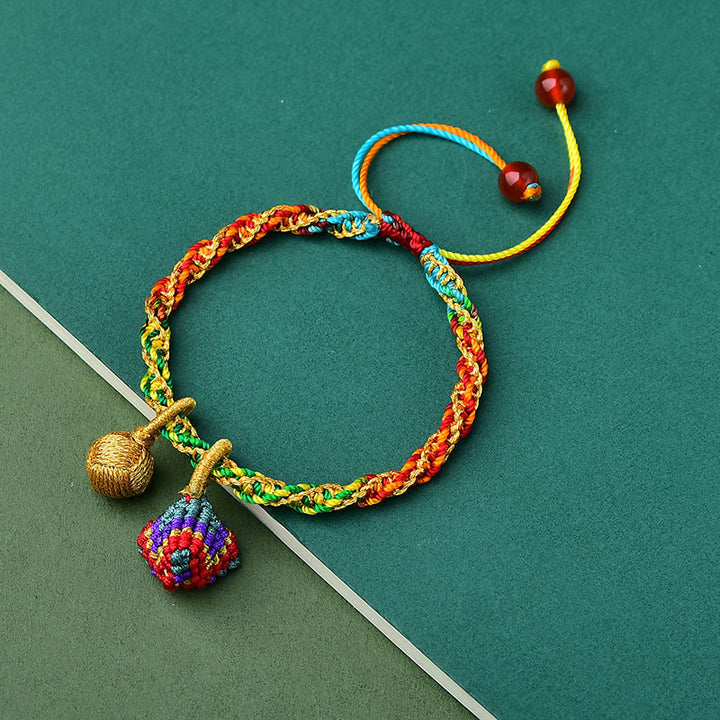 Pulsera con dijes Zongzi hecha a mano con cuerda colorida y Buddha Stones