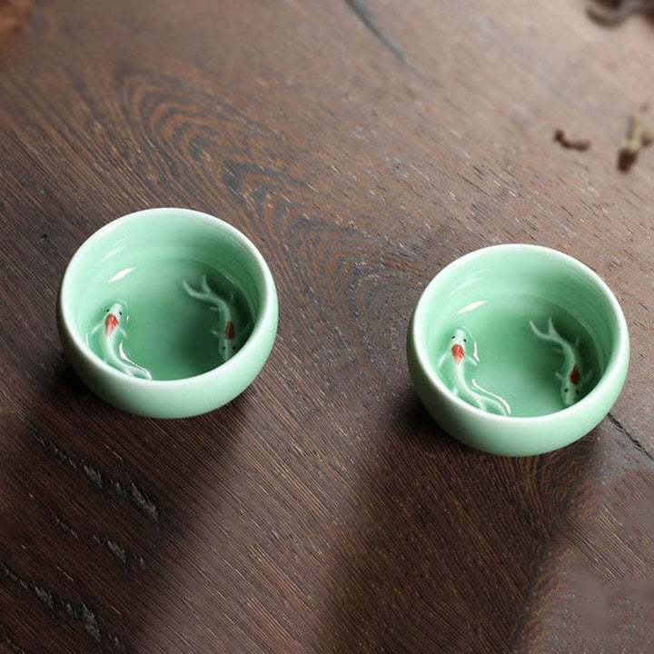 Taza de té de cerámica con forma de pez koi de colores y Buddha Stones