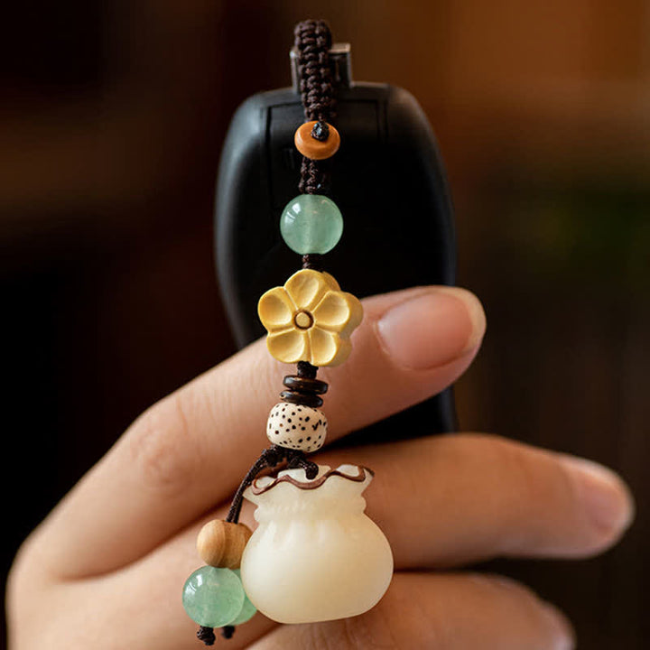 Llavero de prosperidad y bendición de flores, bolsa de dinero con semillas de Bodhi Natural, Buddha Stones