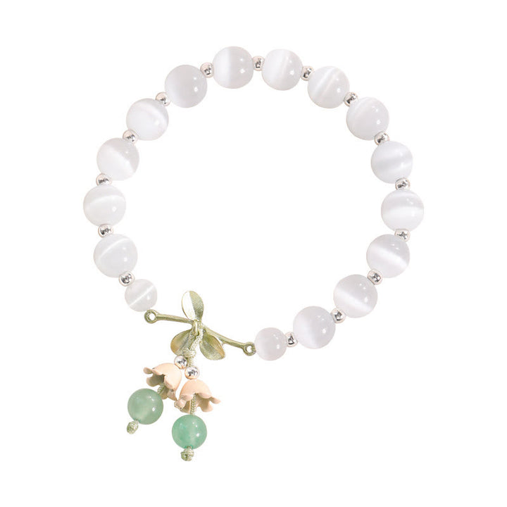 Pulsera con dije de orquídea de la paz, cristal rosa, calcedonia azul, aventurina verde, ojo de gato , Buddha Stones - image 1